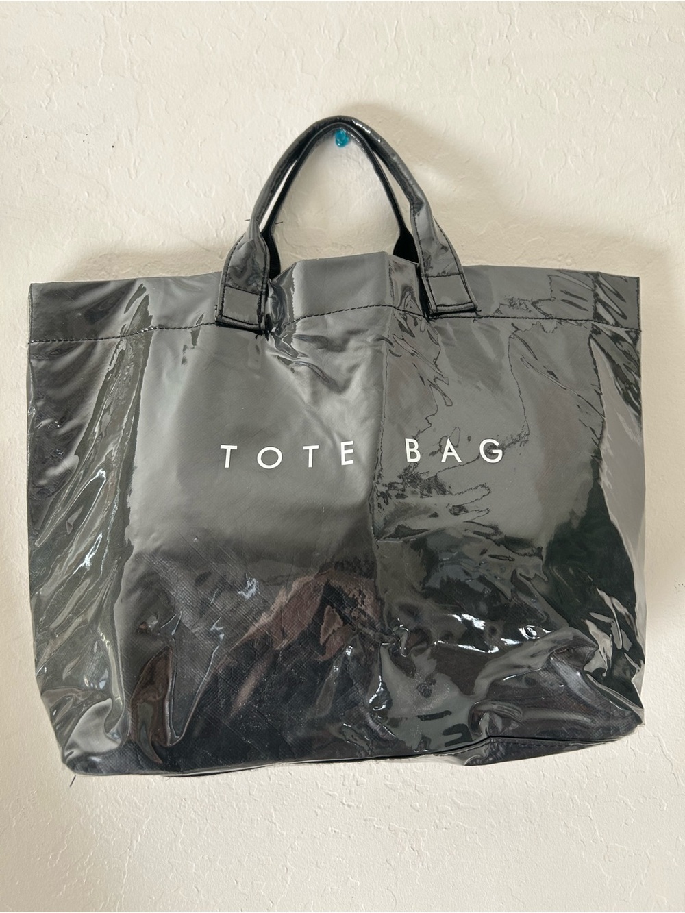 Glossy Gray Tote Bag with White 'TOTE BAG' Logo